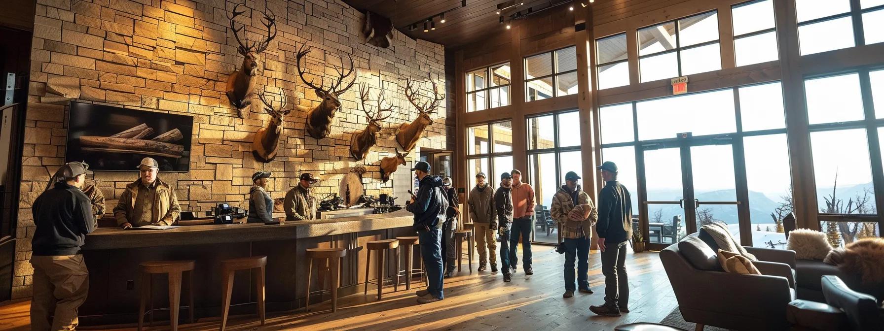 a sleek, modern lodge interior showcases an elegant wall adorned with mounted trophies, while a group of well-dressed hunters attentively listens to an experienced guide explaining strategies for their exclusive luxury hunting experience in wyoming's diverse wildlife terrain.